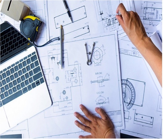 Engineering plans and laptop
